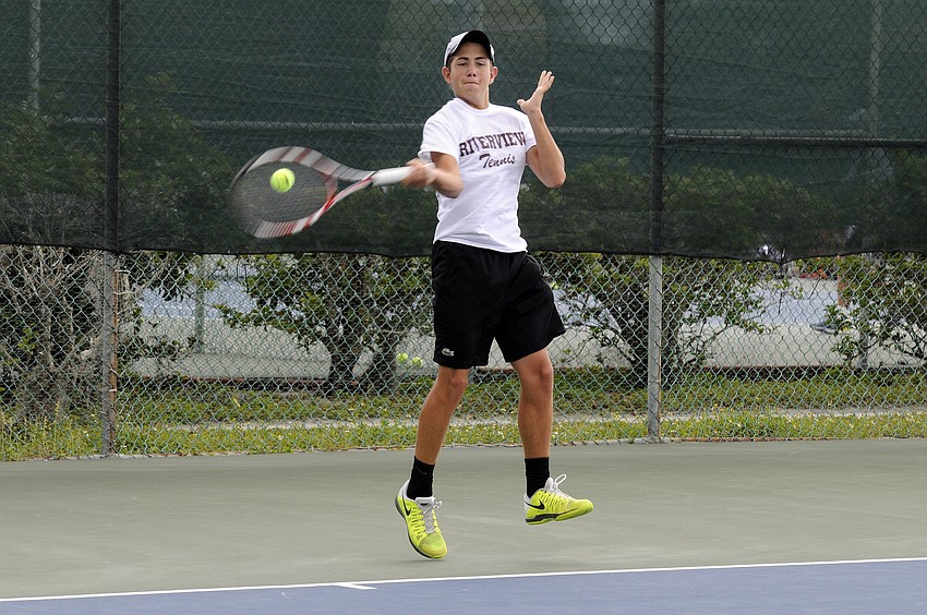 Michael Moore returns a shot during his No. 2 singles match.