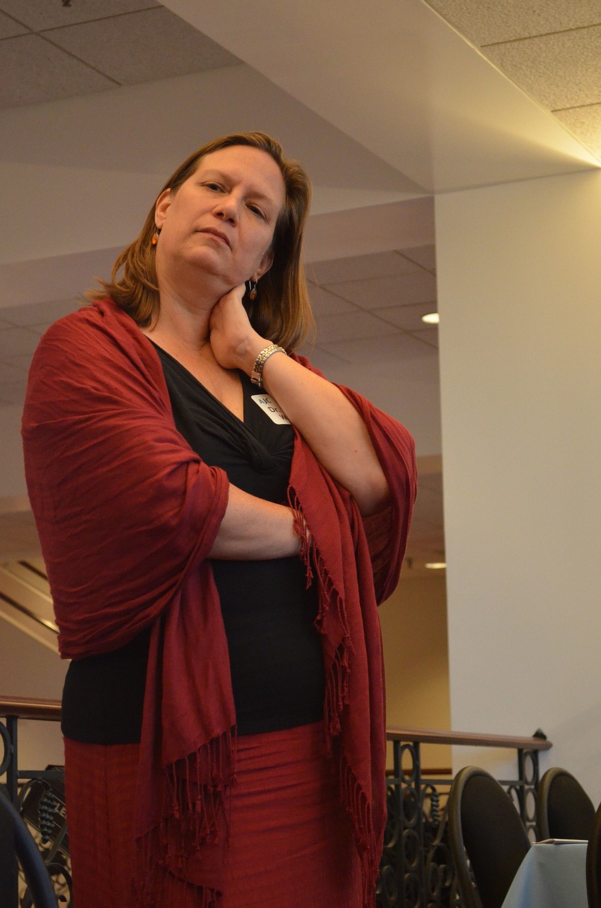 New College English professor Miriam Wallace served at the moderator during the panel discussion.