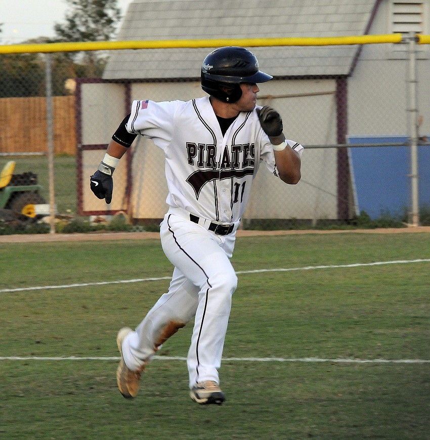 Justin Phillips races down the first base line in the bottom of the third inning.