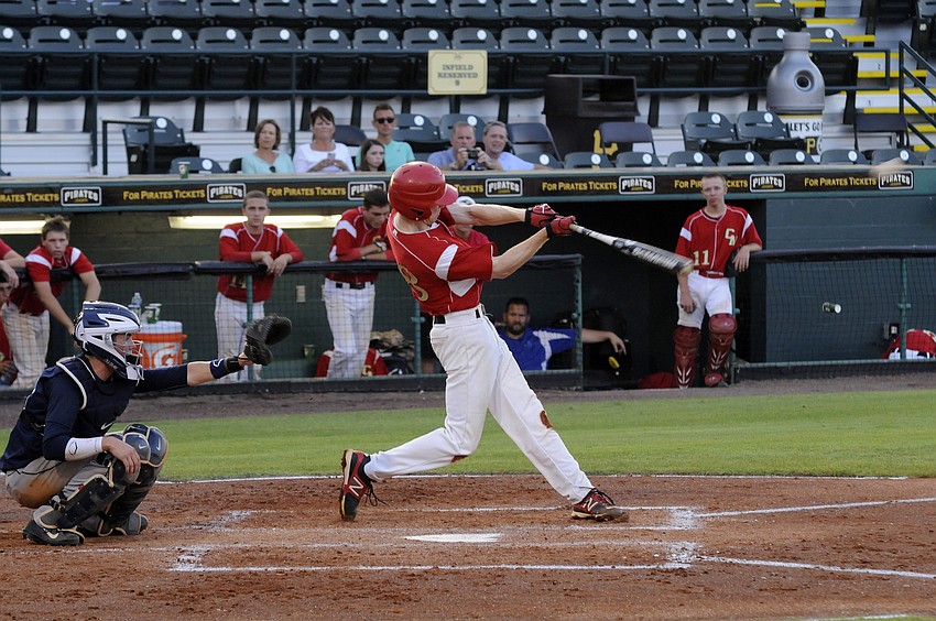Cardinal Mooney junior Flynn Angly sends a fly ball to left field.