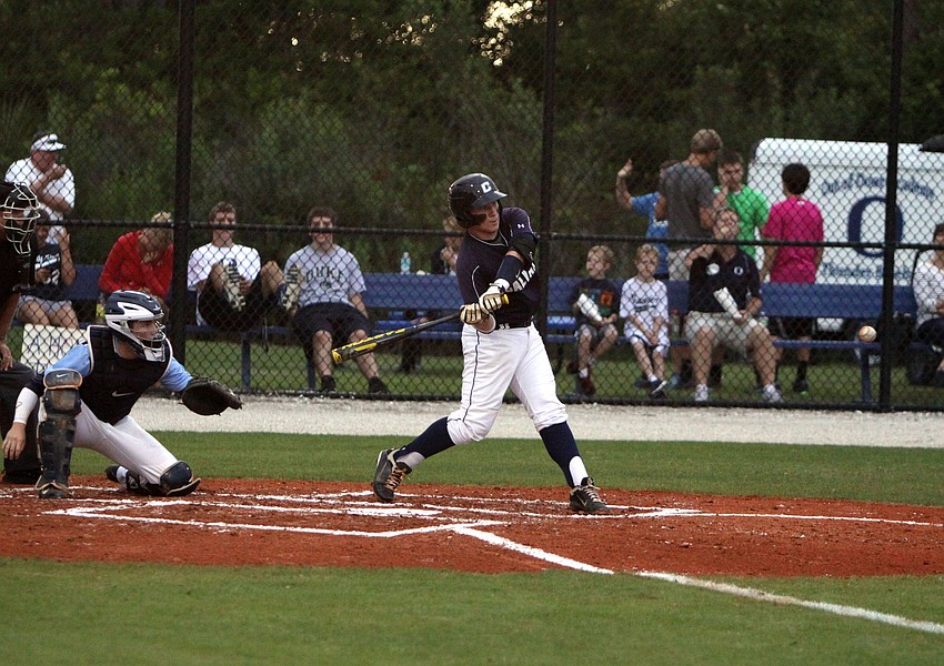 Christian Calvaryâ€™s Jake Richardson, No. 18, goes to hit the ball.