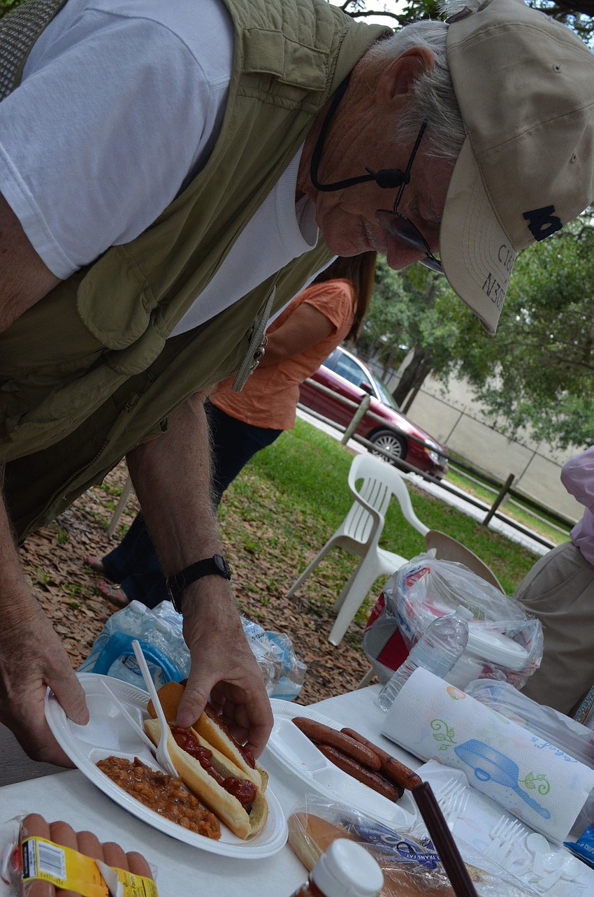Walter Elwell gets ready to dig into a hot dog.