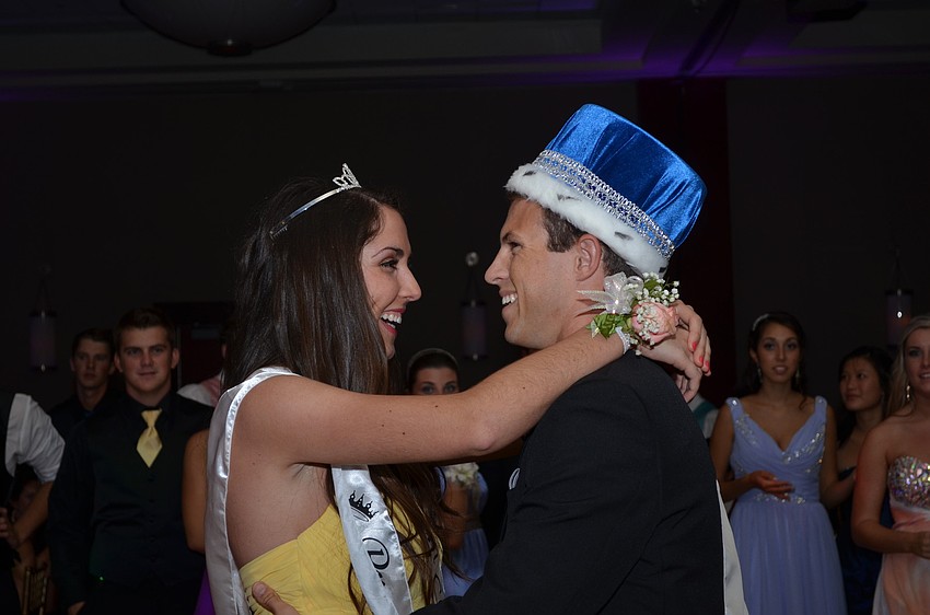 The king and queen have their first dance.