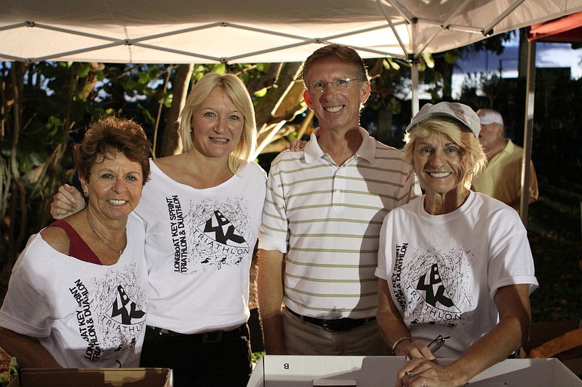 Carol Peschel, Dawn Mims, Greg Hayes and Joyce Welch were just some of the many volunteers who helped out at the Longboat Key Sprint Triathlon Sunday, May 5, out at the Longboat Key Club.