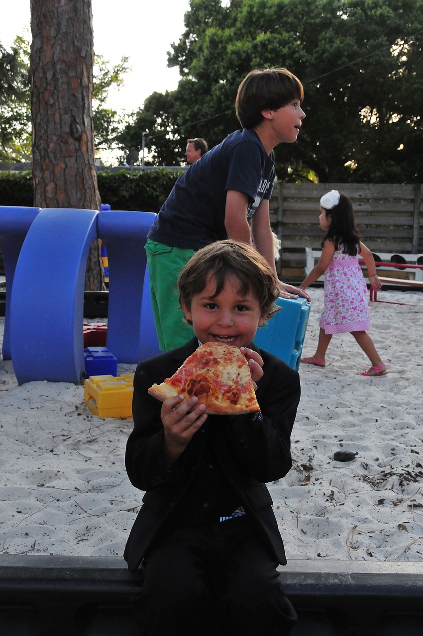 Quenten Newcomb enjoys a slice after a successful graduation.