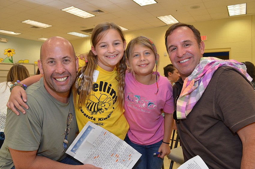 David Chessler and his daughter Jordyn (third from left) came out to support McKenzie Braid with her father Eric.