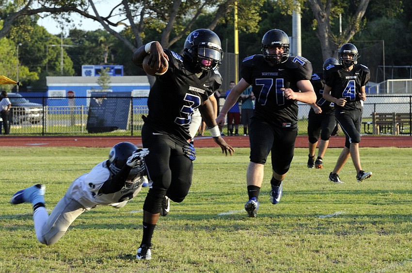 ODA junior defensive back David Grain trips up a Northside Christian running back to negate a big gain.