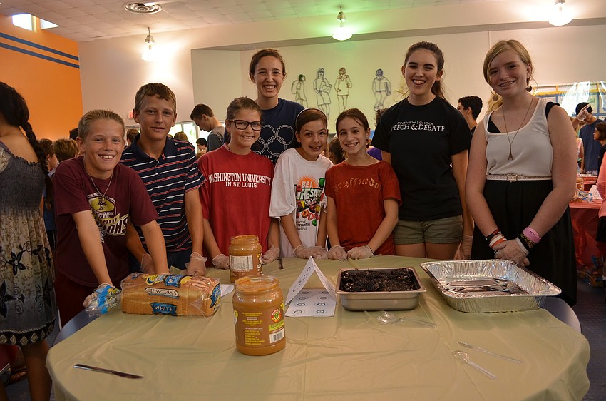Students Brenan Carey, Cade Koerick, Sarah Brickman, Annie Sutherland, Eva Bayer, Gabriella Ispaso, Alexis Dinenberg and Sara White helped break the world record for sandwiches made in an hour.