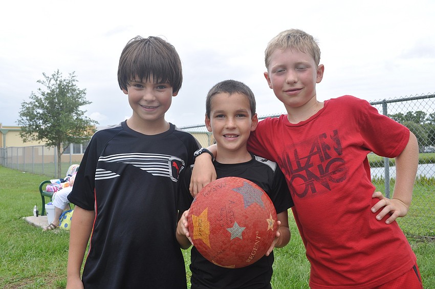 Noah Ellis, Aiden Brown and Isaac Ashley took a break from kick-ball.