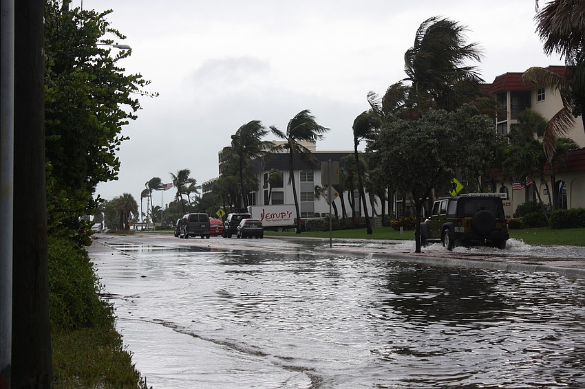 Several cars stall in the flooded streets of Siesta Key, while Tropical Storm Andrea tracks northeast.