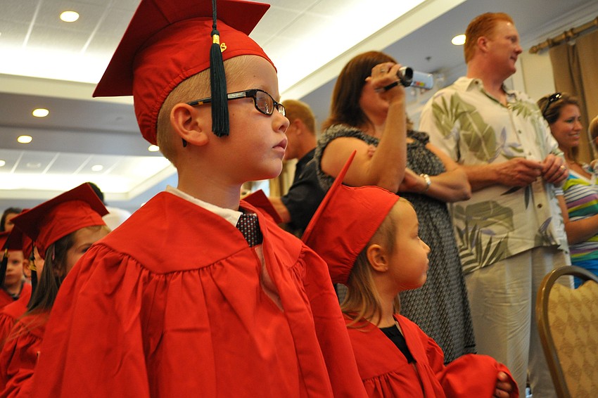 Brock Morgan looks for his parents in the crowd, as Primrose students march into the room.