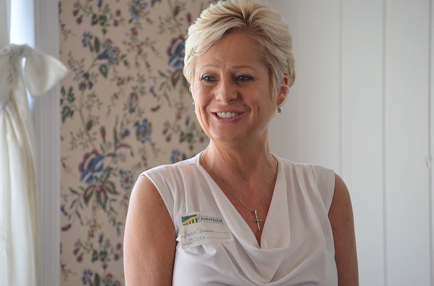 Barbie Robinson speaks to Chamber Members during breakfast.