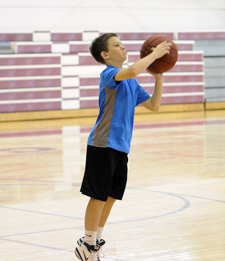 Twelve-year-old MJ McMahon goes up for a jump shot.