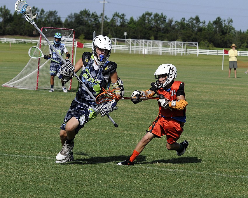 Attackman Alec Frank positions himself in front of a Tampa Elite defender to keep him from advancing the ball.