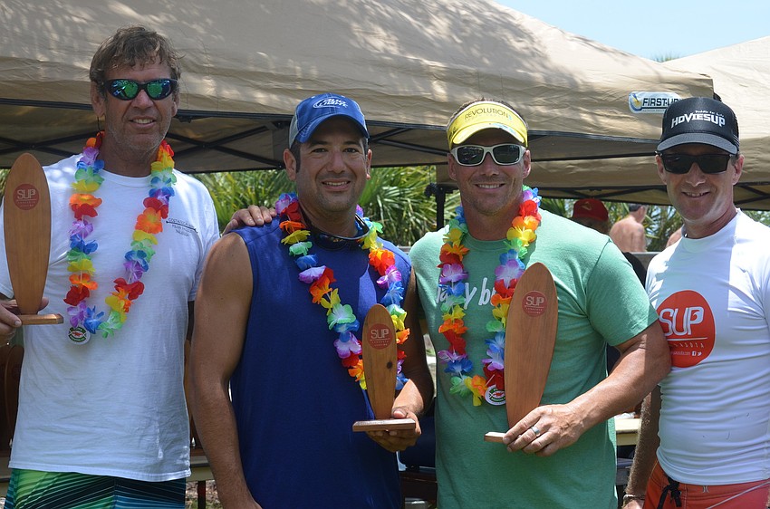 Menâ€™s open second place winner Bill Blain, third place winner Robert Matarazzo, first place winner Kiwi Rapihana and founder of the Sarasota Stand Up Paddle Board Series Rob Alfier