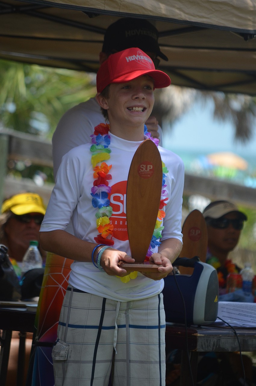 Will Martson received first place with his 12.6-foot board in the junior division of the elite race.