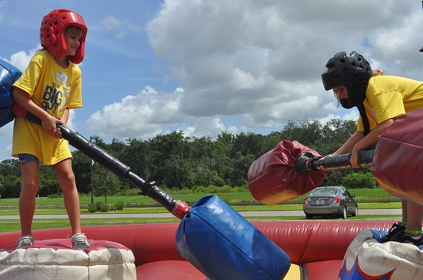 Paige Bright and Rebecca Richardson joust.