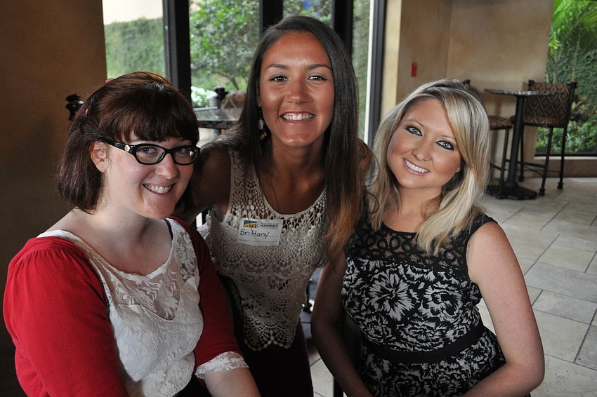 Marty Gibbons, Brittany LaPinska and Natalie Roderick welcome guests.