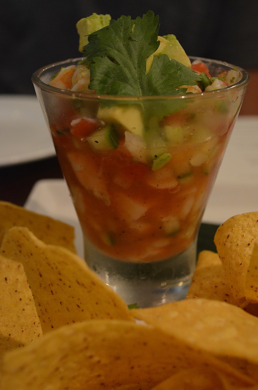 The captiva cocktail is made with chilled tiger shrimp, spicy vegetables, lime and chips for $12.