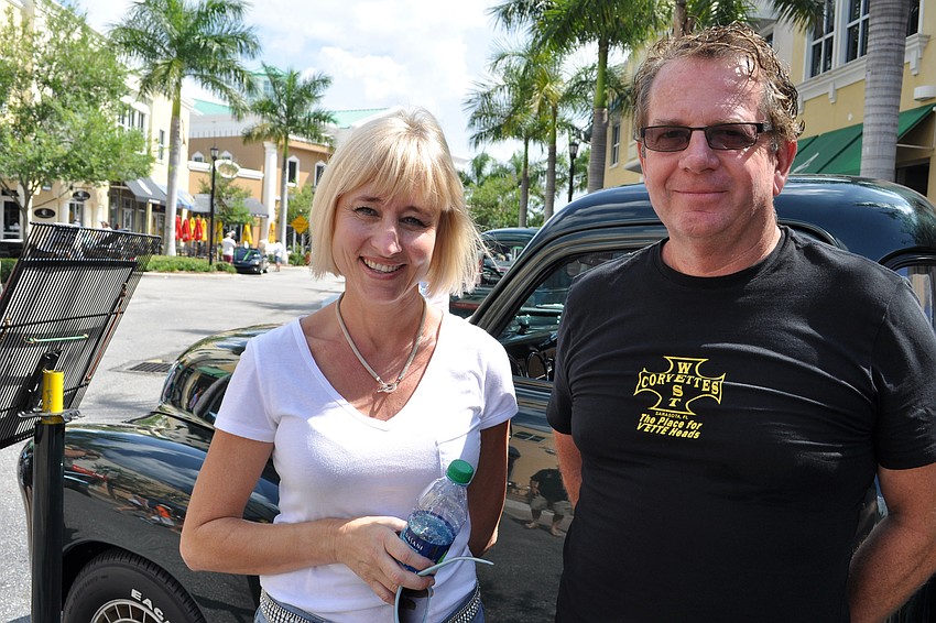 Jonnie Dwyer shows off her five-window 1952 Chevy pickup with Tommy Moller.