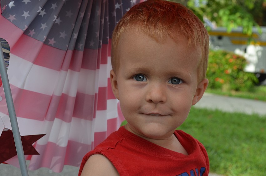 Colin Bankert, 2, enjoys riding in his wagon.