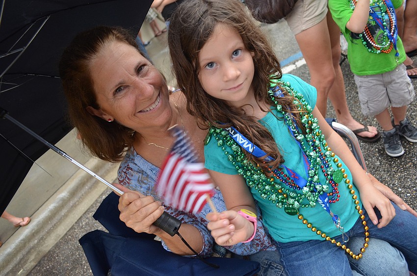 Ellen Phillips and her granddaughter Ella Abernathy, 5, watch the parade.