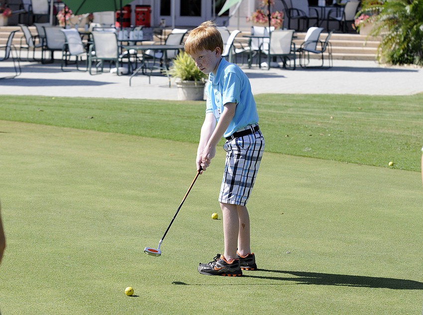 Cooper Rennie, 8, admitted putting was kind of difficult because it was hard to read how hard to hit the ball.