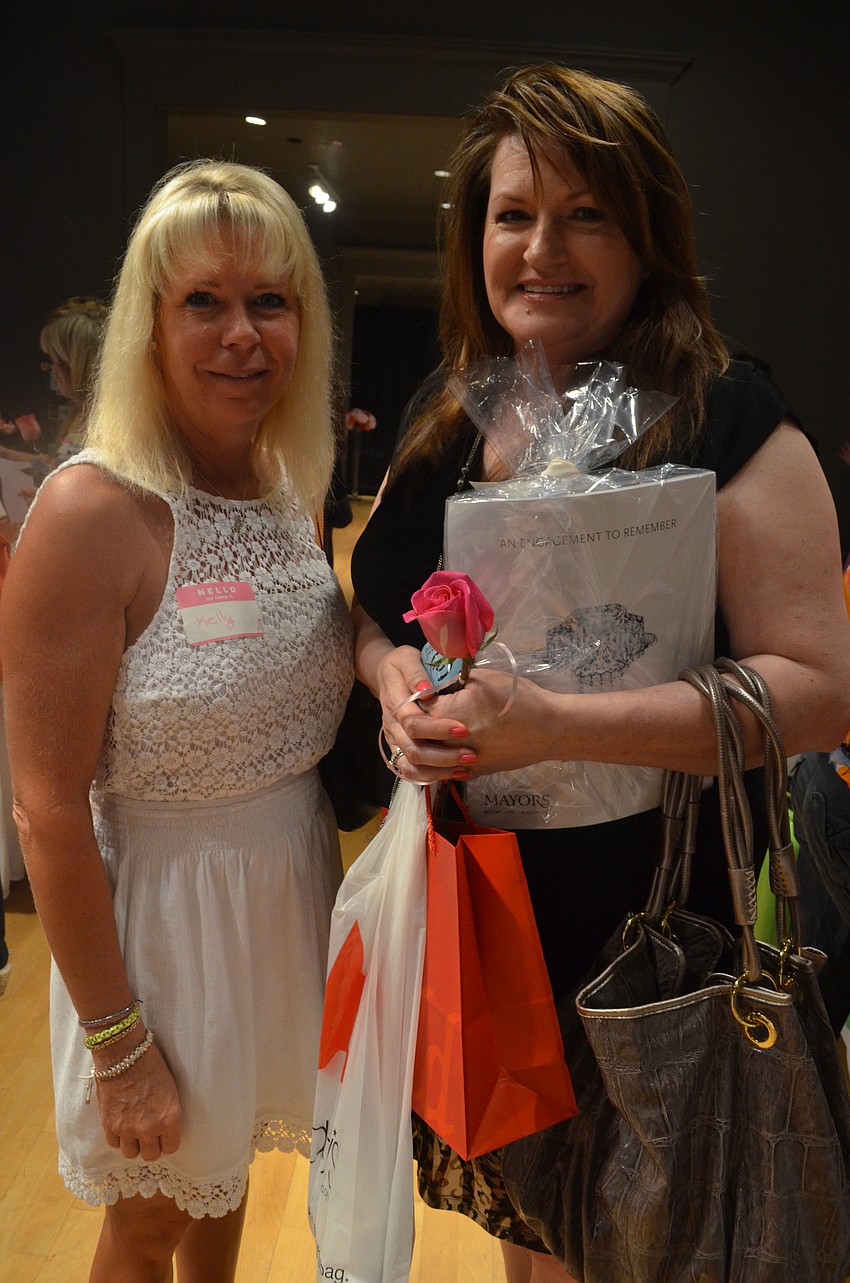 Kelly Lee will marry in October. She searches and finds a gown with her friend Leisa Young.