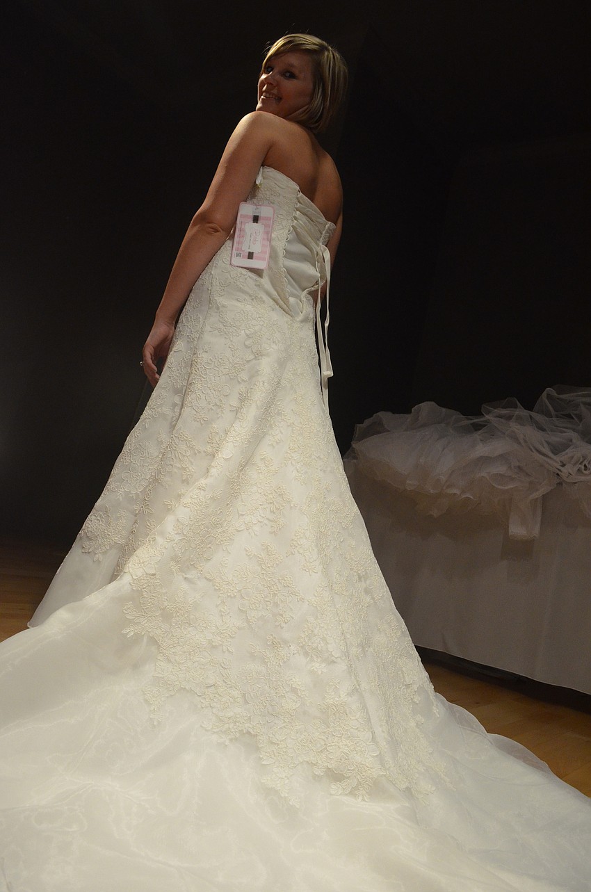 Stacie Miller tries on a vintage lace dress. She is will marry May 17, 2014.