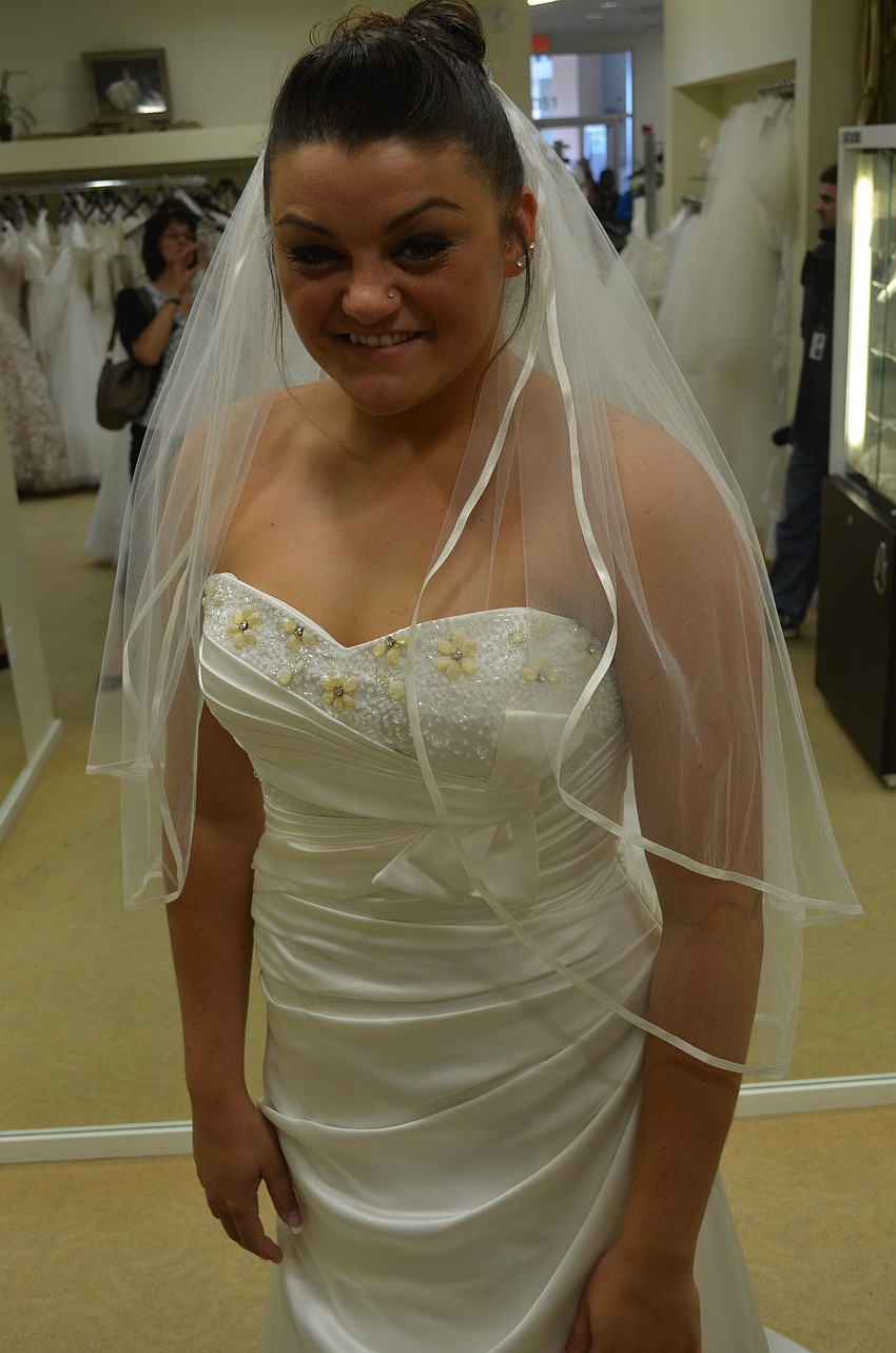 Emily Otero found her perfect dress at Sarasota Brides and Formalwear at the Brides Across America event. Her fiancÃ© is currently in Afghanistan and they will get married in March 2014. The dress she chose was the first wedding dress she ever tried on.