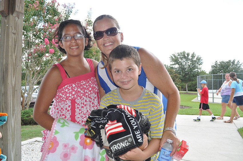 Alexandra Collado with her children, Liliana and Max, who she fostered and then adopted