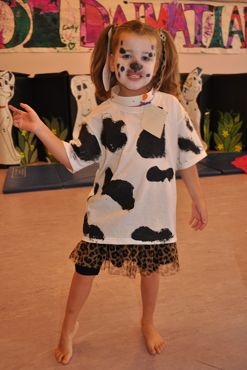 Alanna Bray, 7, dances, as a puppy named Biscuit.