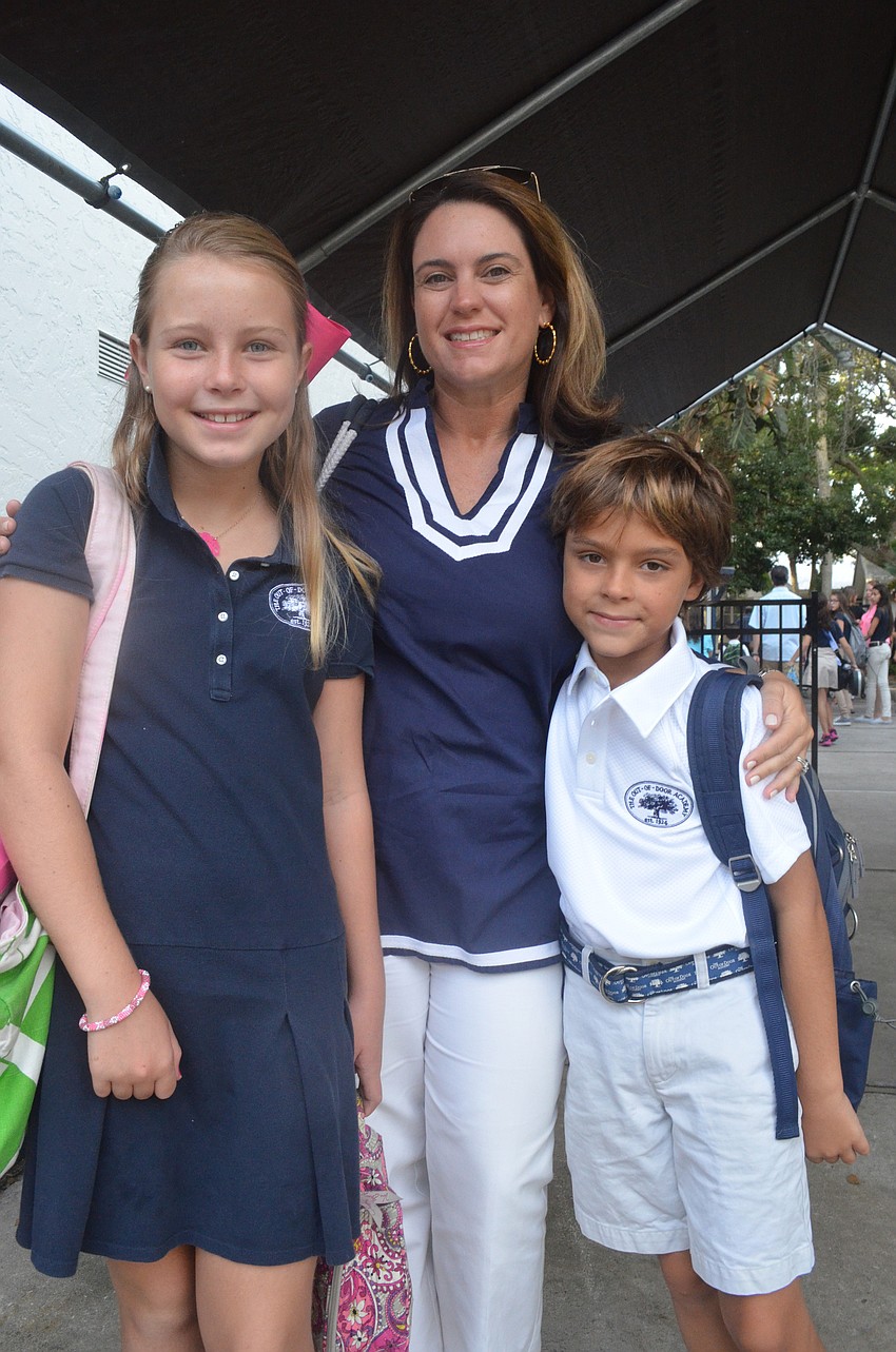 Lesley France drops off her children Kaki, 10, and Jackson, 8, for the first day of school.