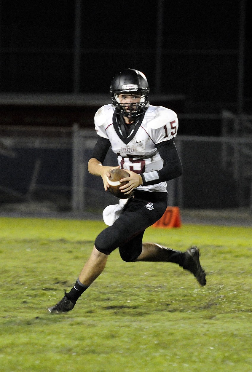 Quarterback Dusty Peebles scrambles for yardage early in the third quarter.
