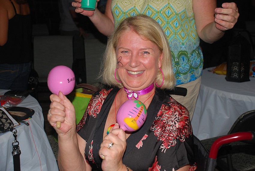 Lorna Smith plays along in time to the music.