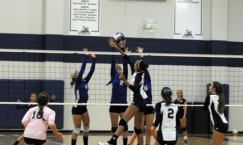 The Out-of-Door Academyâ€™s Reanna Gregory goes up for a kill.