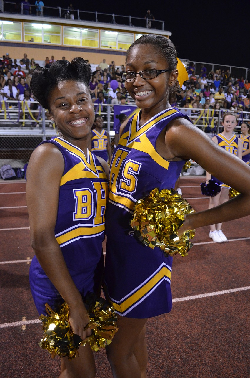 Booker High School cheerleaders and juniors Jermeria Williams and Shaquira Lawson cheer on their team.