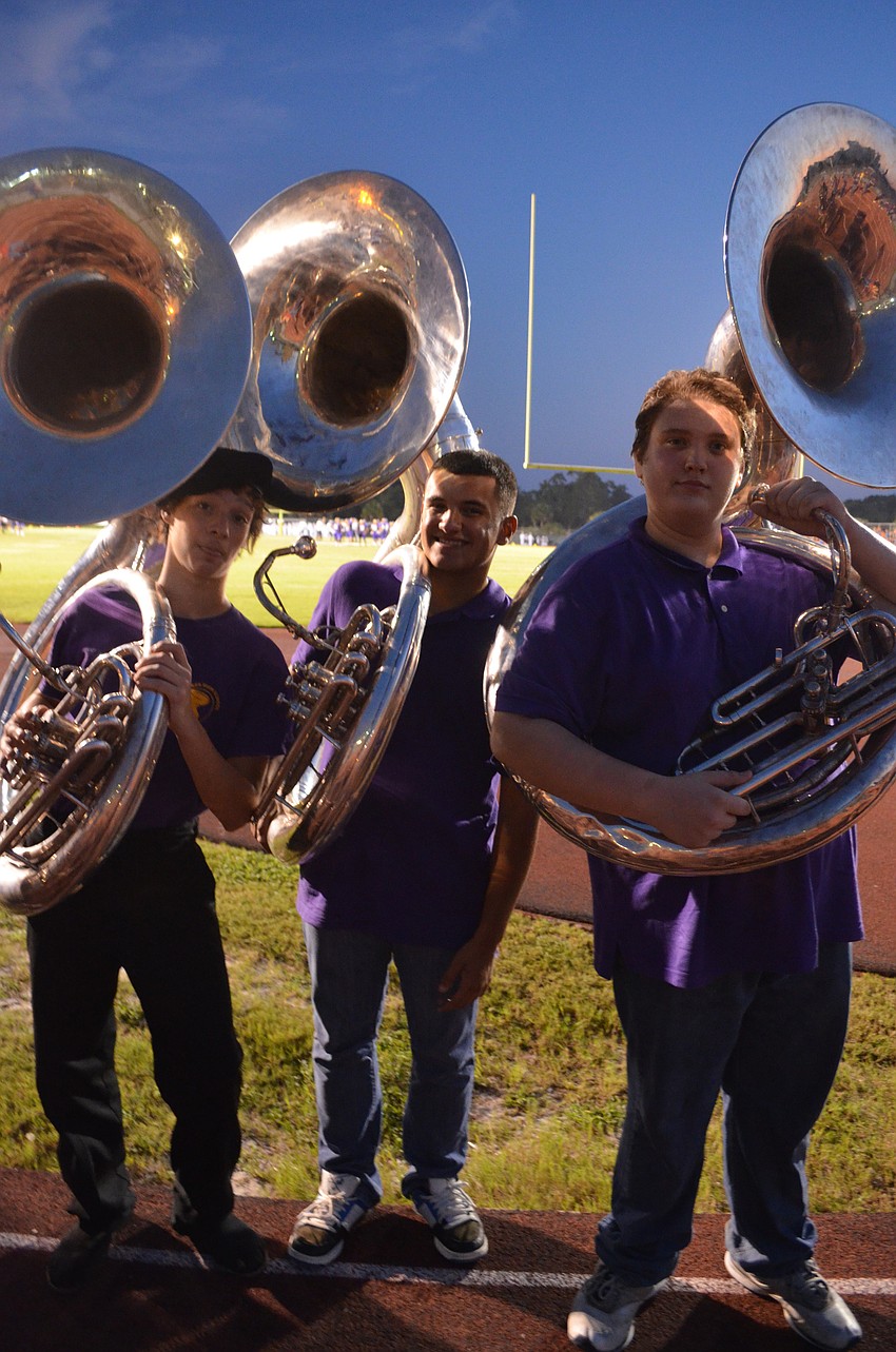 Booker High School tuba players Vincent Cobian, Juan Maldonado and Michael Hughes