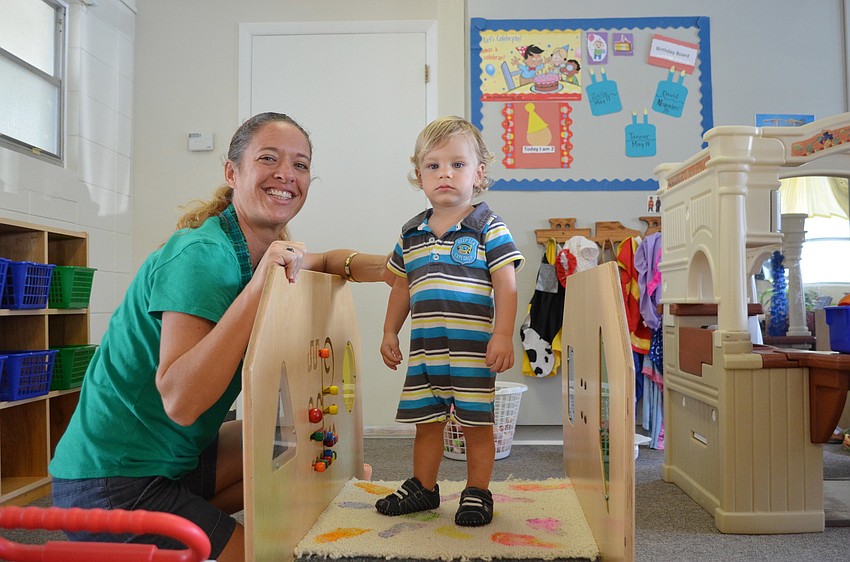 Sarah Schebel and Zaile F. enjoy playtime on the climbing gym.