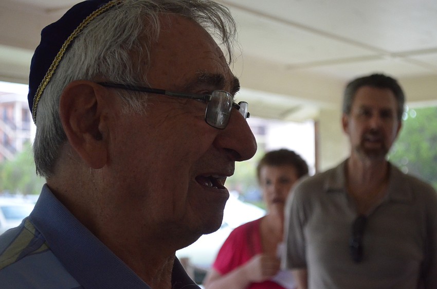 Bernie Yablon sings traditional songs like Ose Sholom with the group.