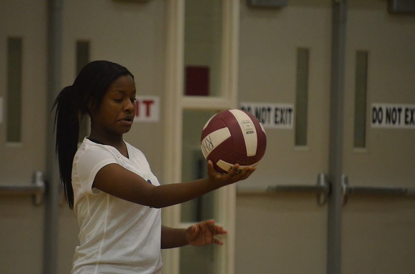 Booker player Anitra Clark gets ready to serve the ball.