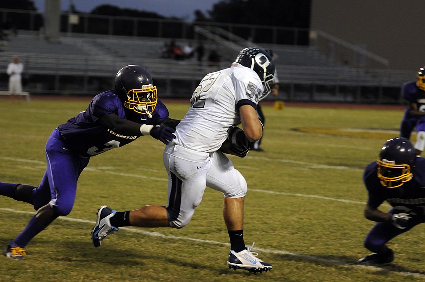Booker linebacker Darius Jones attempts to wrap up ODA senior Max Provost.