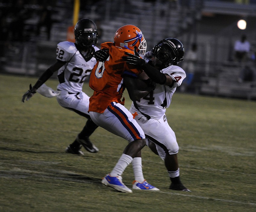 Braden River cornerback Davion Banks wraps up Southeast running back Larry Woodard.