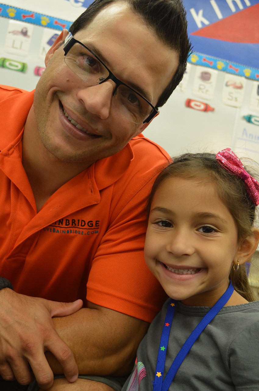 Carlos Castillo visits his daughter, Danelle, in the classroom.