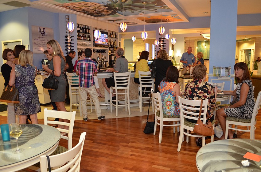 St. Armands Association members mingle at the membership meeting Tuesday, Sept. 17, at Hotel Indigo.