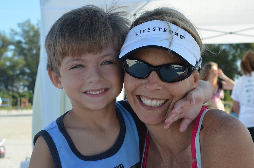 Kolbe Huffman, 7, excitedly greets and hugs Director of C.A.R.E Dr. Kirstina Ordetx.