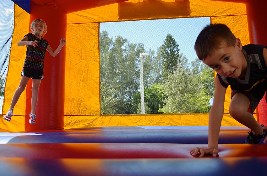 Paige and Parker McElyea jump in the jumping gym.