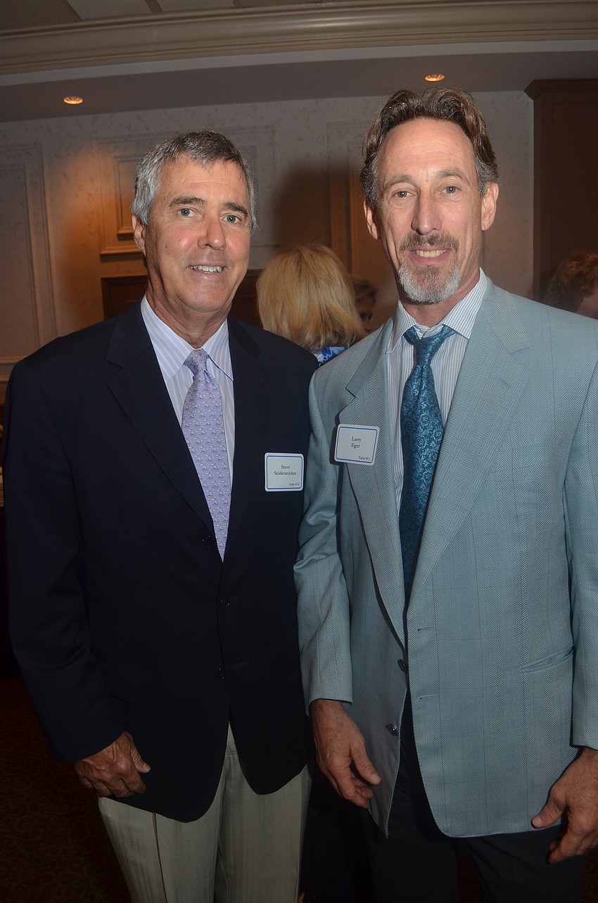 Board member Steve Seidensticker and public defender Larry Eger