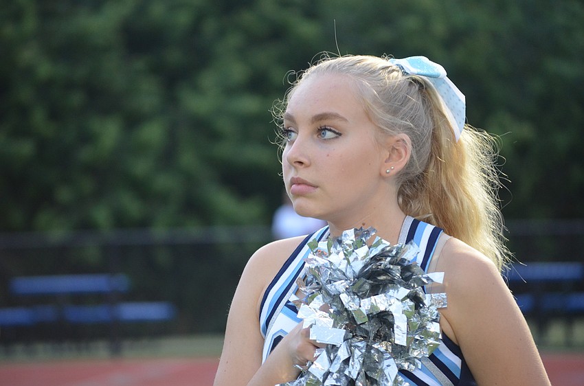 Dana Saltz, 15, stands for the National Anthem.