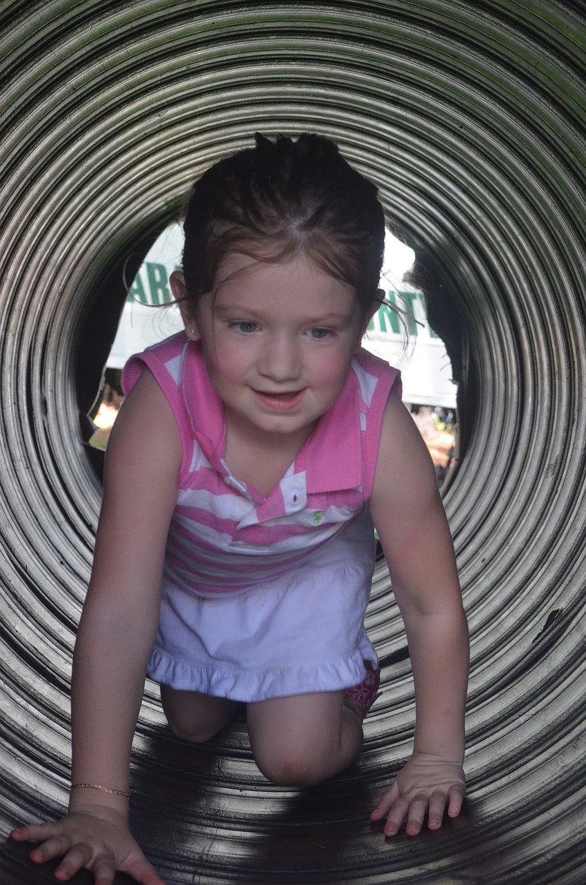 Madison Bell, 4, completes the SWAT Combat Challenge.